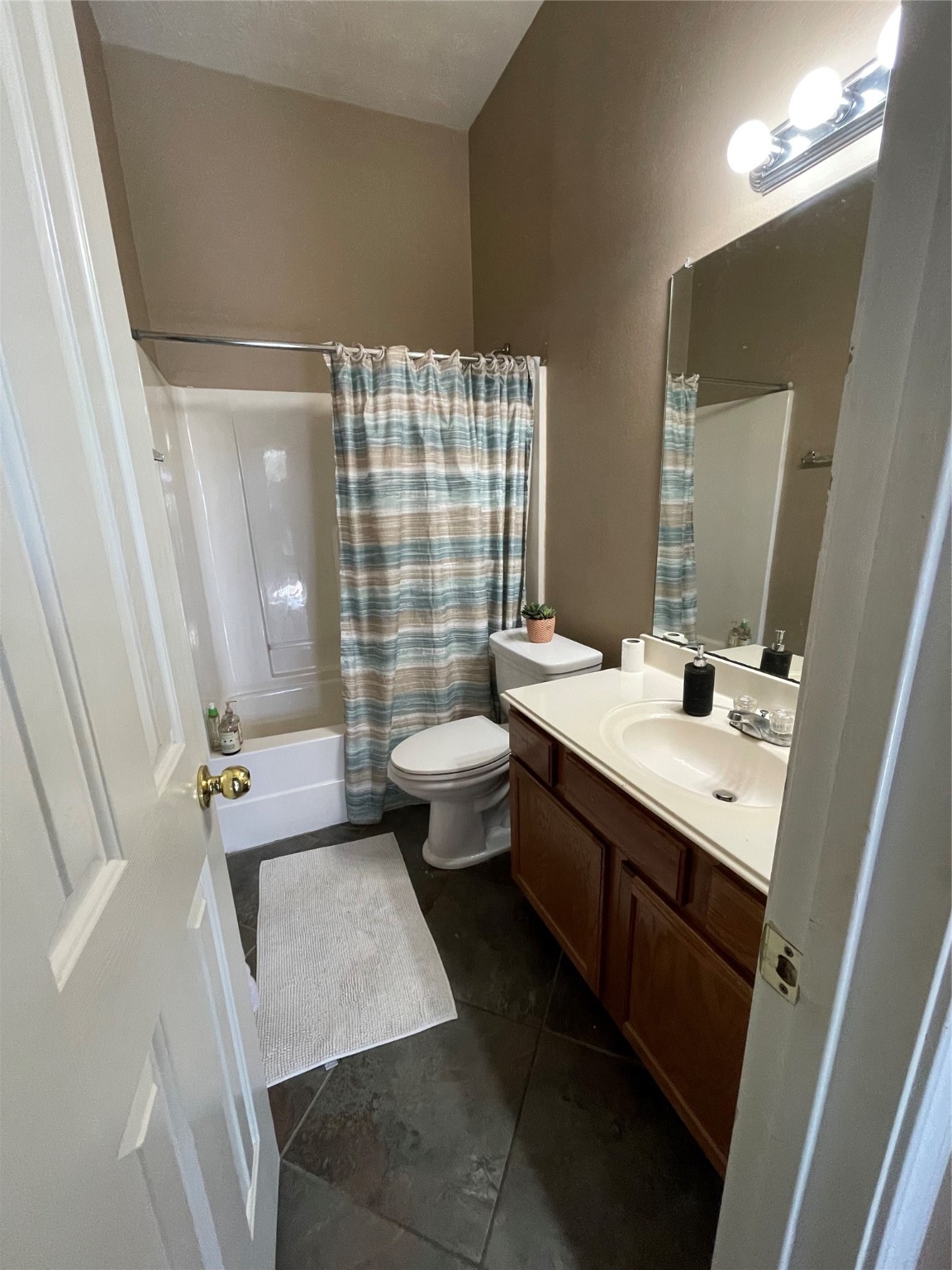 22911 Sebastian Drive Porter, TX 77365 - Photo 8 of 10 a bathroom with a double vanity sink toilet and shower