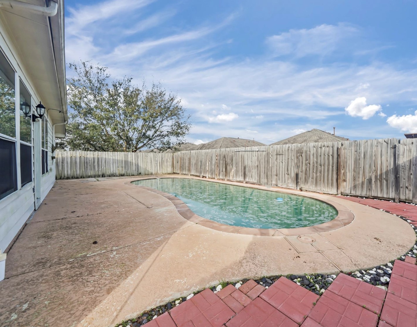 22911 Sebastian Drive Porter, TX 77365 - Photo 9 of 10 a view of a backyard with a fountain