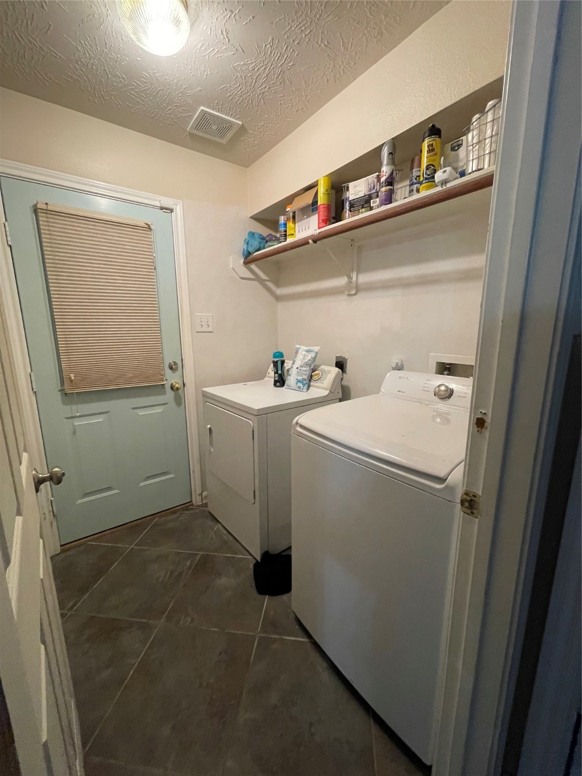22911 Sebastian Drive Porter, TX 77365 - Photo 10 of 10 a utility room with dryer and washer