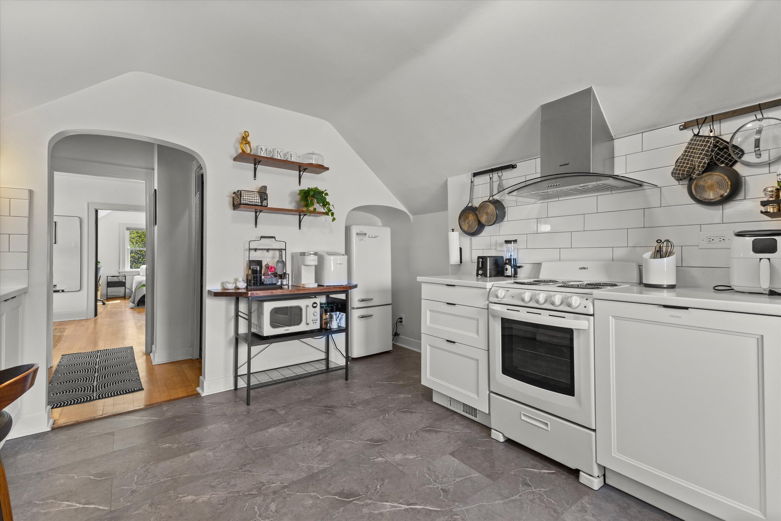 159 North 59th Street Milwaukee, WI 53213 - Photo 8 of 34 Remodeled kitchen with modern finishes and open shelving
