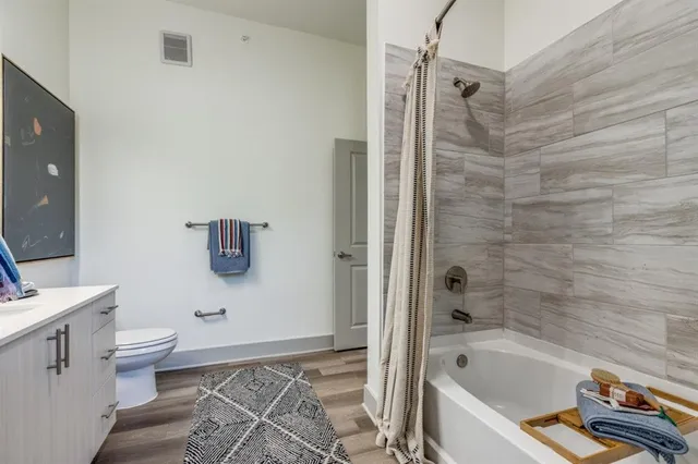 a bathroom with a bathtub and shower