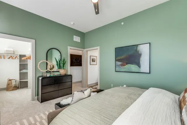 a bedroom with bed and window