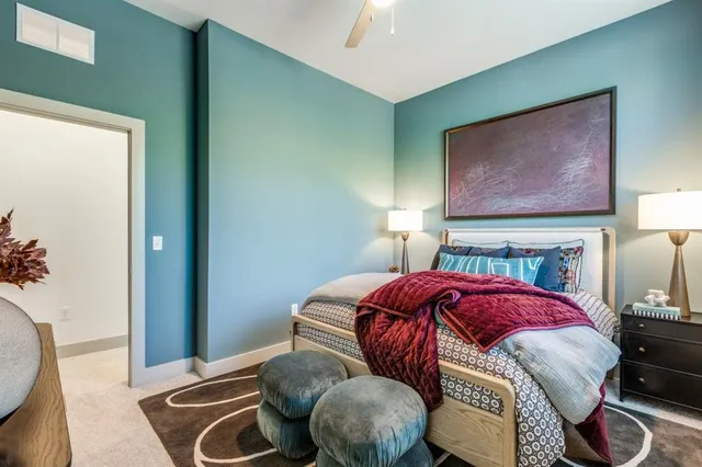 a bedroom with a bed and a couch