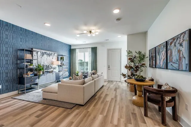 a living room with furniture and a large window