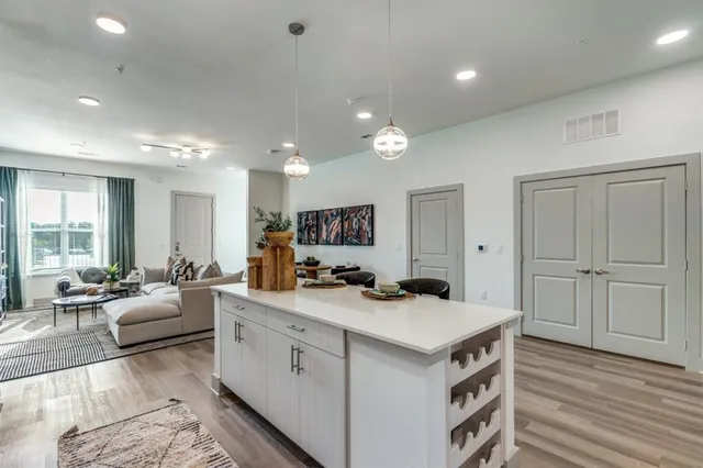 a kitchen with a sink stove and cabinets