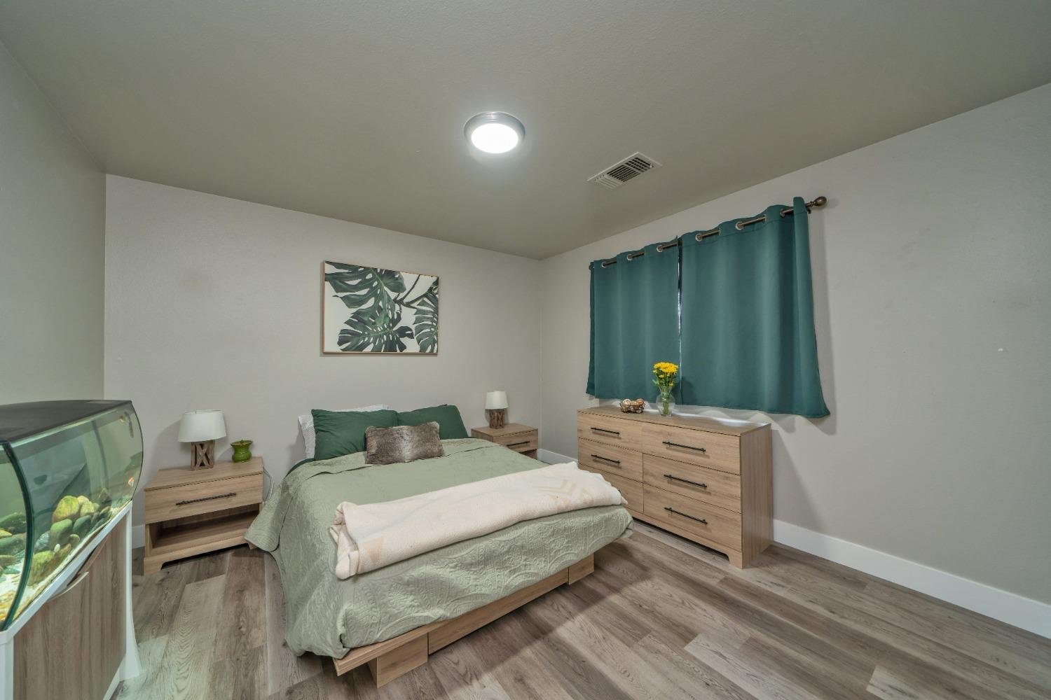 5781 Sly Park Road Pollock Pines, CA 95726 - Photo 13 of 40 a bedroom with a bed and a dresser