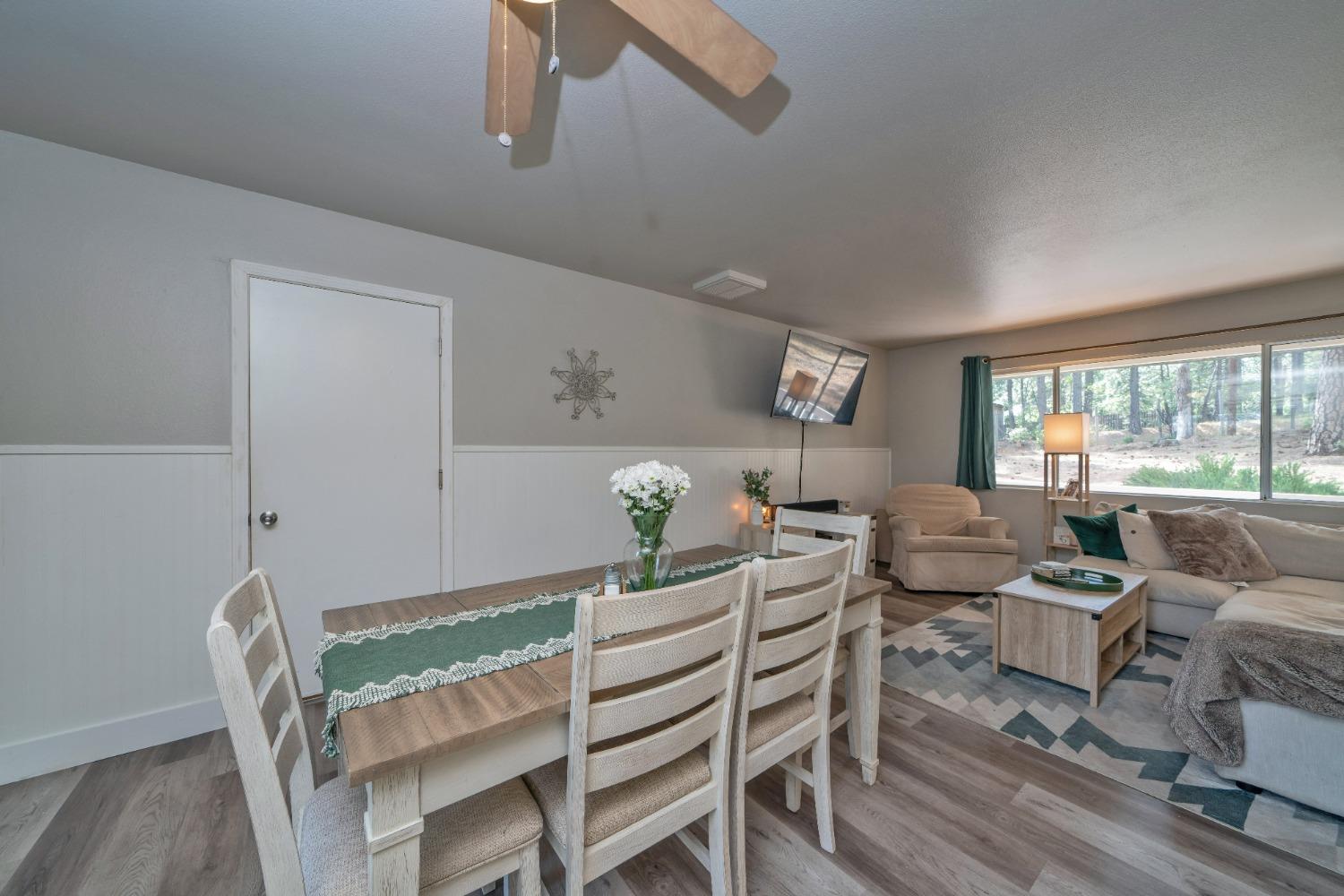 5781 Sly Park Road Pollock Pines, CA 95726 - Photo 17 of 40 a living room with furniture and a large window