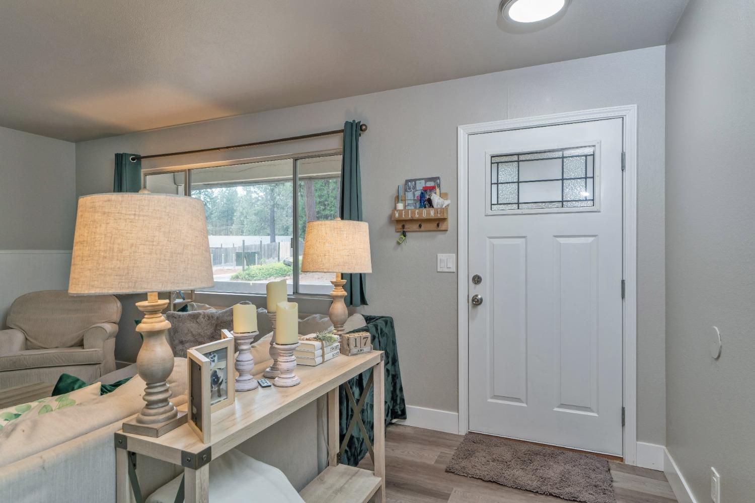 5781 Sly Park Road Pollock Pines, CA 95726 - Photo 21 of 40 a living room with furniture and a window