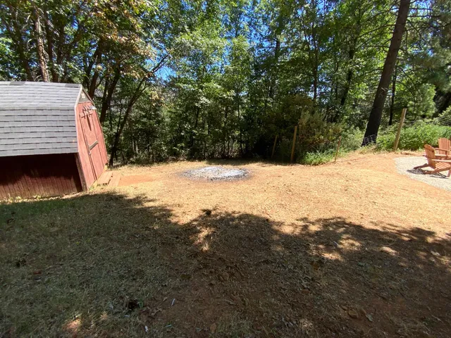 a backyard of a house with a yard and garage