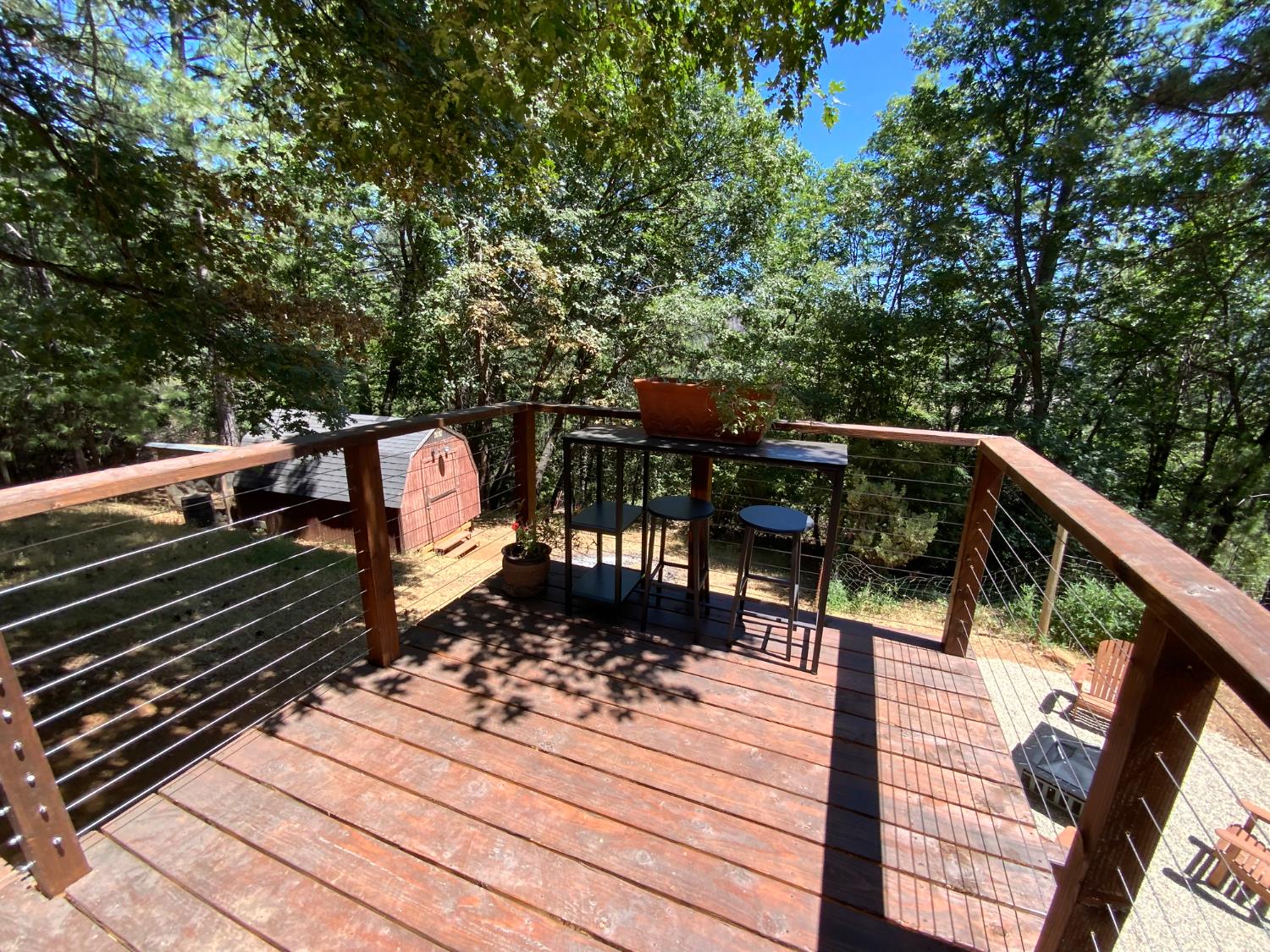 5781 Sly Park Road Pollock Pines, CA 95726 - Photo 29 of 40 a view of a balcony with wooden floor and bench
