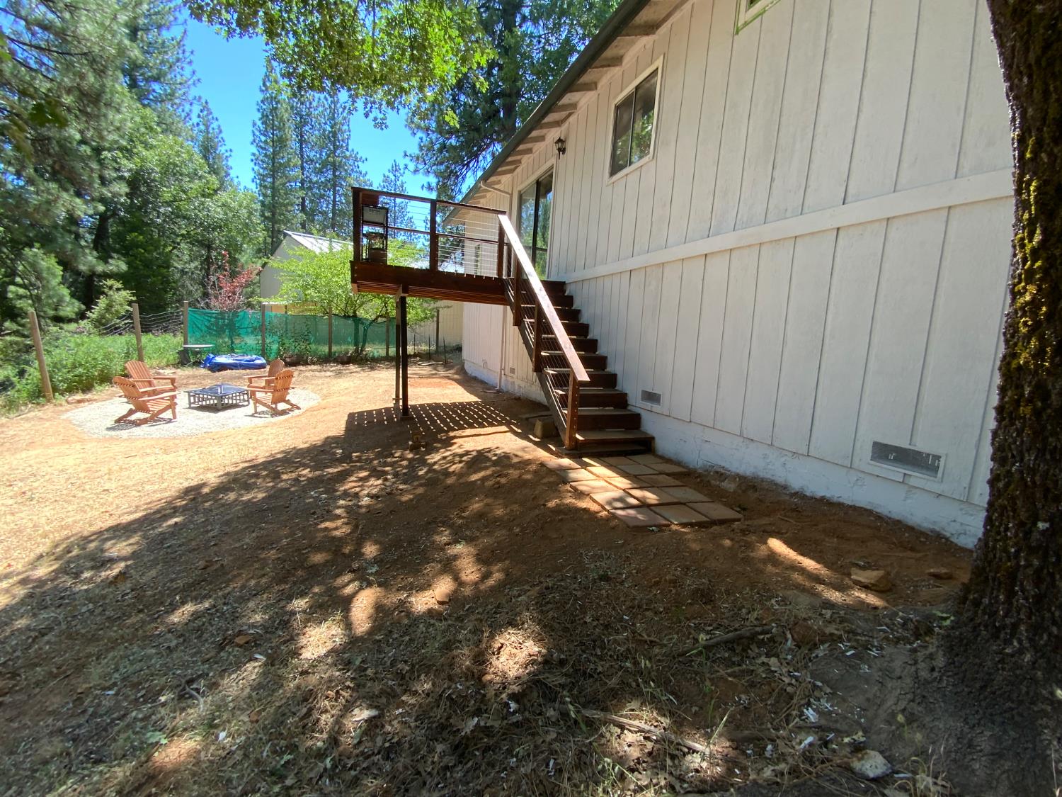 5781 Sly Park Road Pollock Pines, CA 95726 - Photo 34 of 40 a backyard of a house with table and chairs