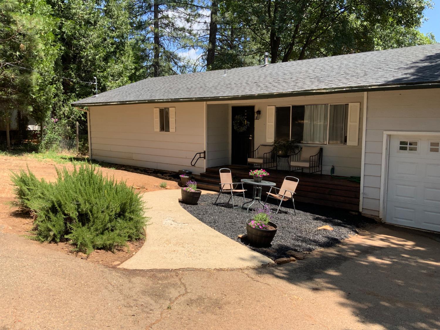 5781 Sly Park Road Pollock Pines, CA 95726 - Photo 36 of 40 a view of a backyard with sitting area and furniture