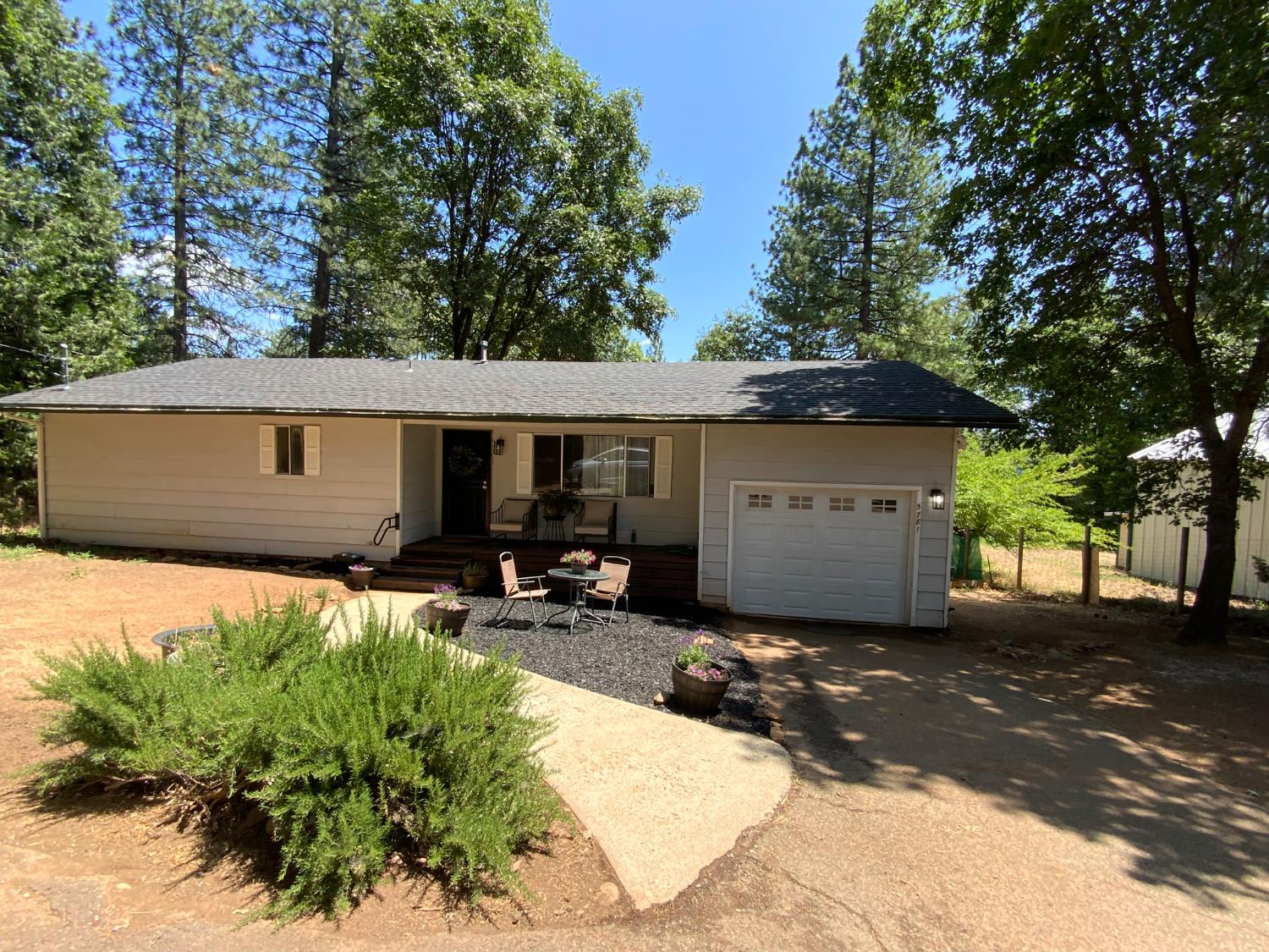 5781 Sly Park Road Pollock Pines, CA 95726 - Photo 39 of 40 a view of a house with a patio