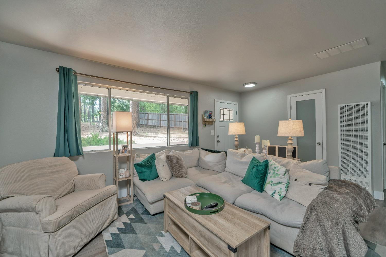 5781 Sly Park Road Pollock Pines, CA 95726 - Photo 7 of 40 a living room with furniture and a large window