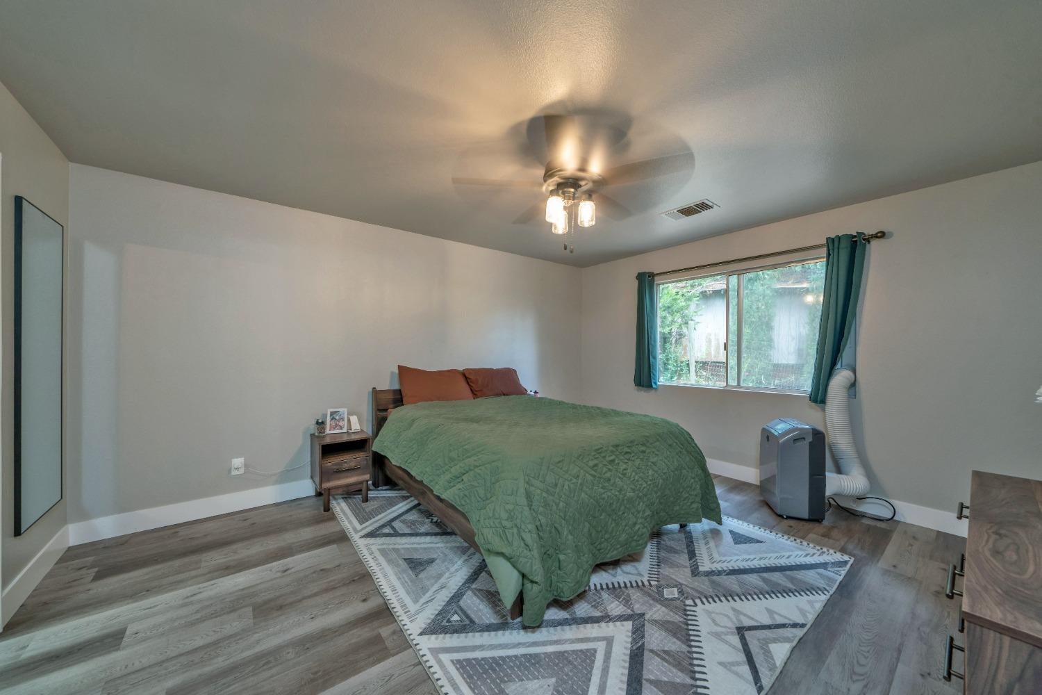 5781 Sly Park Road Pollock Pines, CA 95726 - Photo 8 of 40 a bedroom with a bed and window