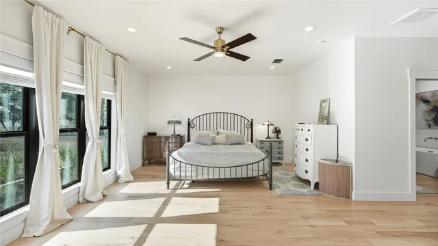 a bed room with a bed and a television