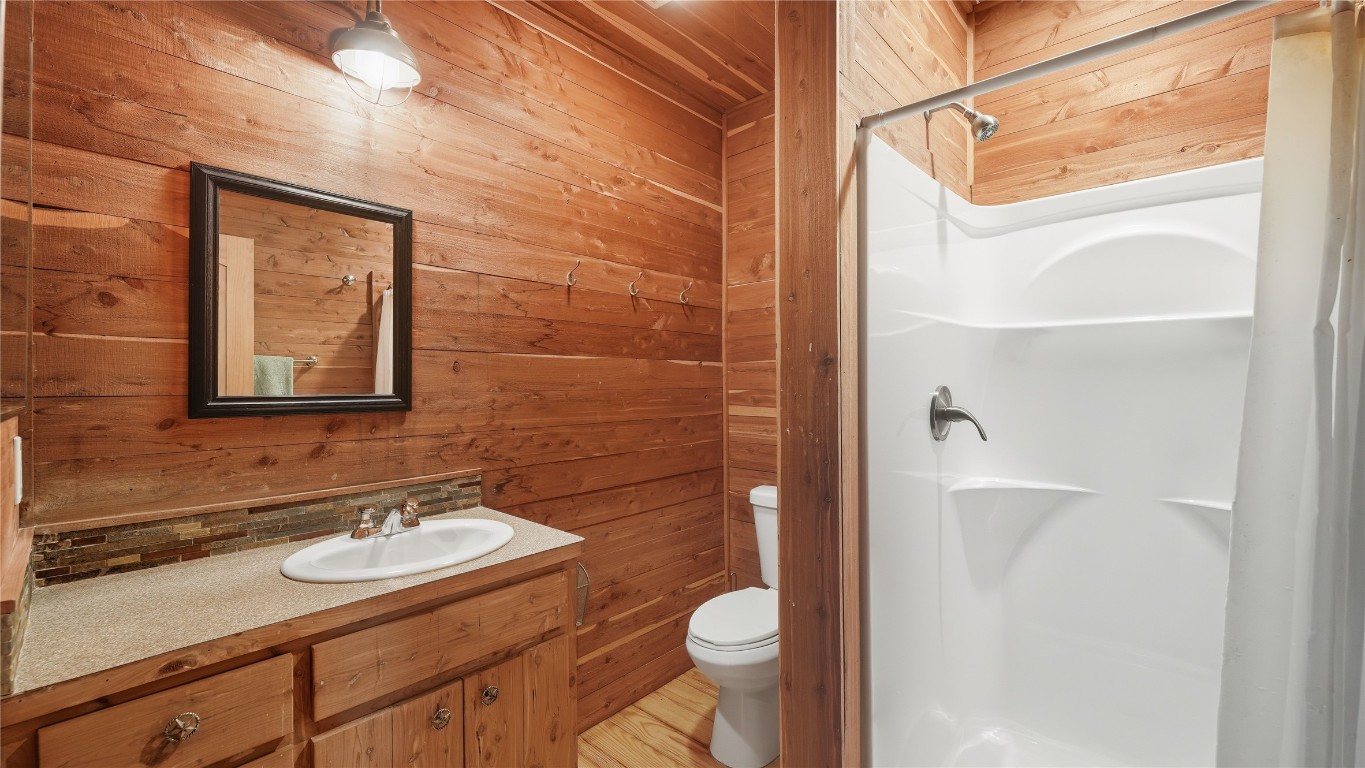 2656 River Bend Road Smithville, TX 78957 - Photo 27 of 40 a bathroom with a sink a toilet and shower