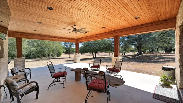 a front view of a house with garden and patio