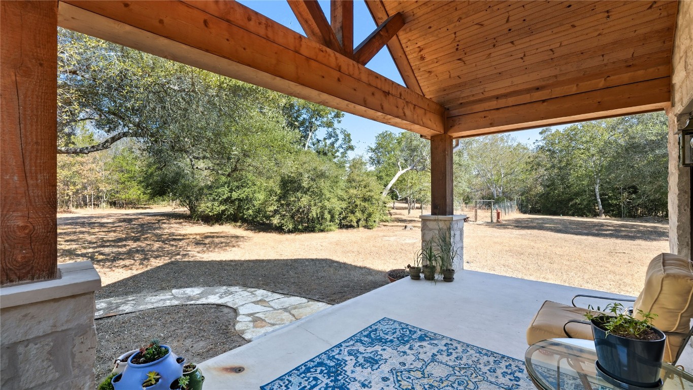 2656 River Bend Road Smithville, TX 78957 - Photo 4 of 40 a front view of a house with garden and patio