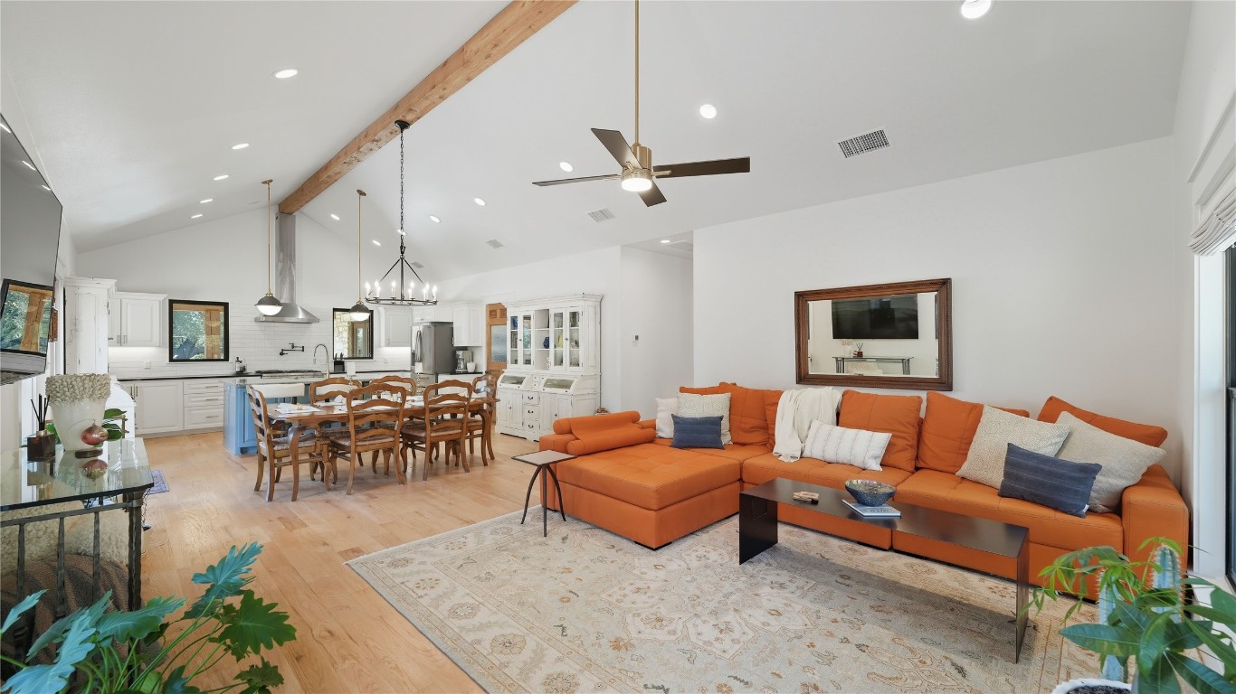 2656 River Bend Road Smithville, TX 78957 - Photo 5 of 40 a living room with furniture kitchen view and a chandelier