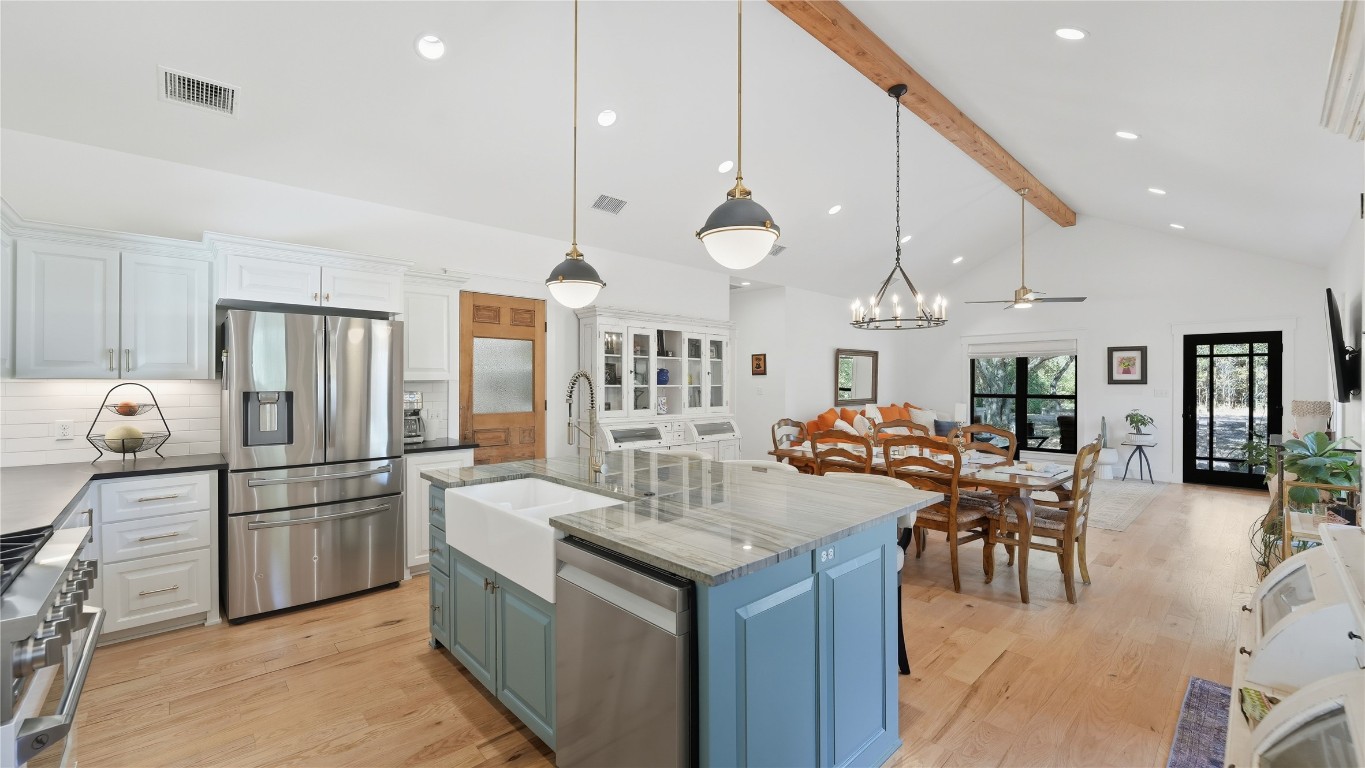 2656 River Bend Road Smithville, TX 78957 - Photo 6 of 40 a kitchen with a sink a counter space stainless steel appliances and cabinets