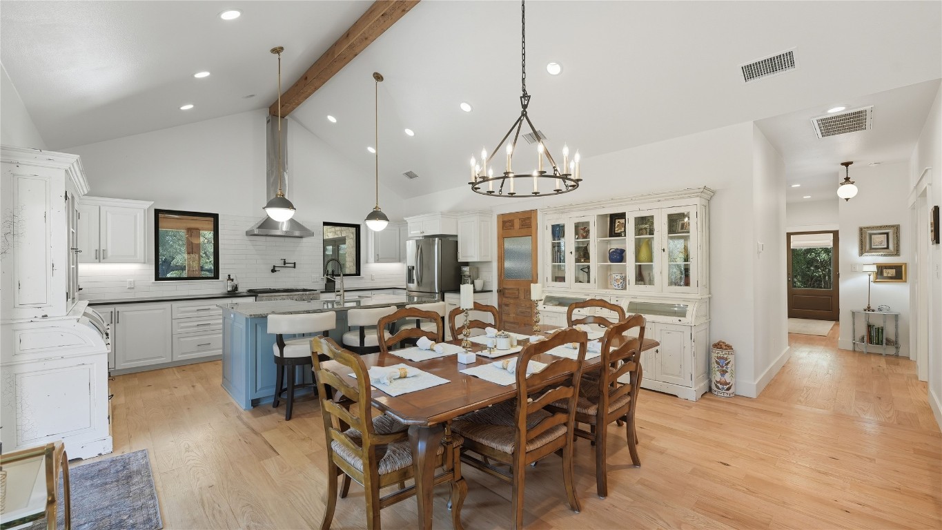 2656 River Bend Road Smithville, TX 78957 - Photo 7 of 40 a view of a dining room with furniture and chandelier