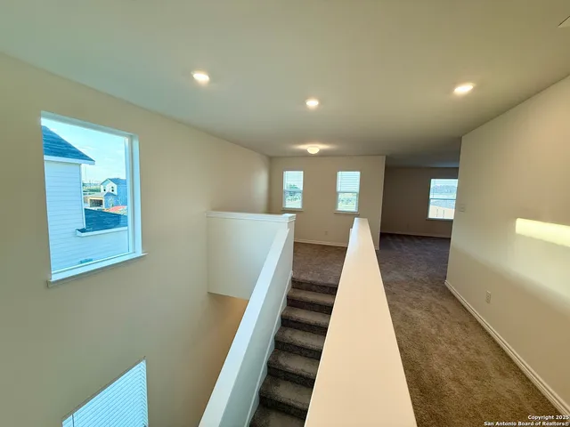 a view of a big room with carpet