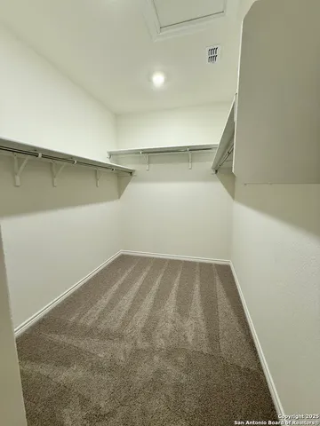a bathroom with a sink vanity and mirror
