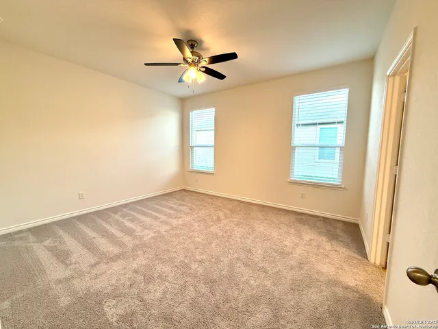a view of a bathroom with a glass door and a shower