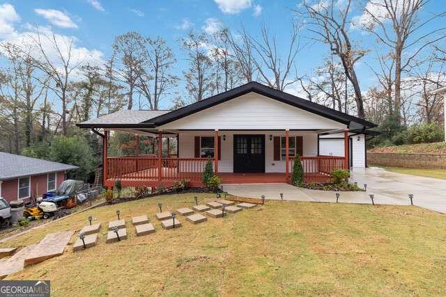 a house with swimming pool in front of it
