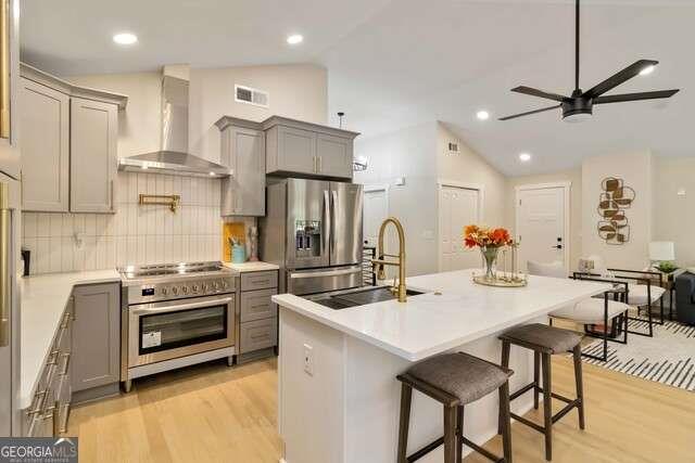 2461 Ridgefield Terrace Decatur, GA 30033 - Photo 3 of 15 a kitchen with stainless steel appliances a stove a sink island and a refrigerator