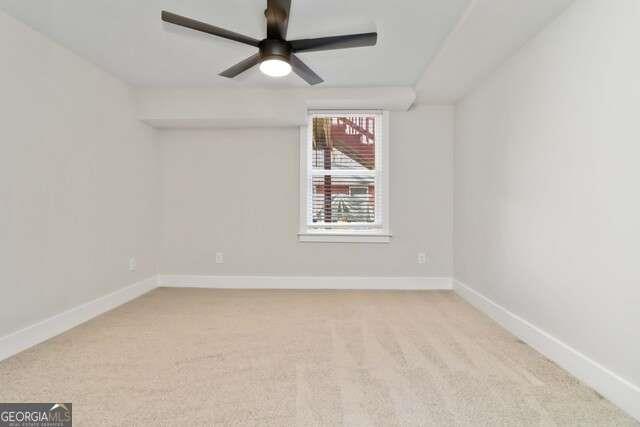 2461 Ridgefield Terrace Decatur, GA 30033 - Photo 10 of 15 an empty room with a window and a fan