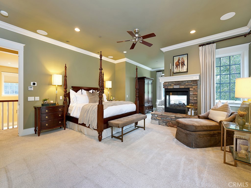 28291 Williams Canyon Road Silverado, CA 92676 - Photo 28 of 74 a spacious bedroom with a bed and a fireplace