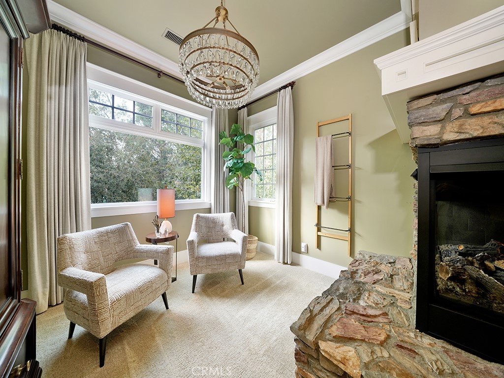 28291 Williams Canyon Road Silverado, CA 92676 - Photo 32 of 74 a spacious bedroom with a bed and a chandelier