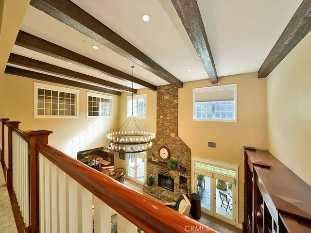a living room with furniture gym equipment and a view of kitchen