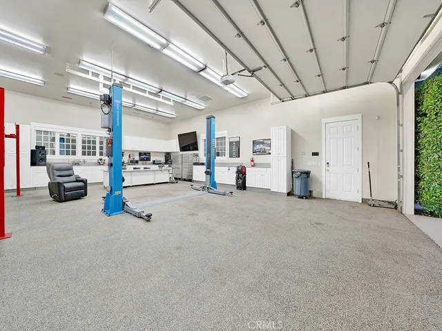 an outdoor space with patio and white umbrellas
