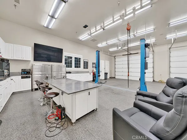 an aerial view of a house with a yard and garden