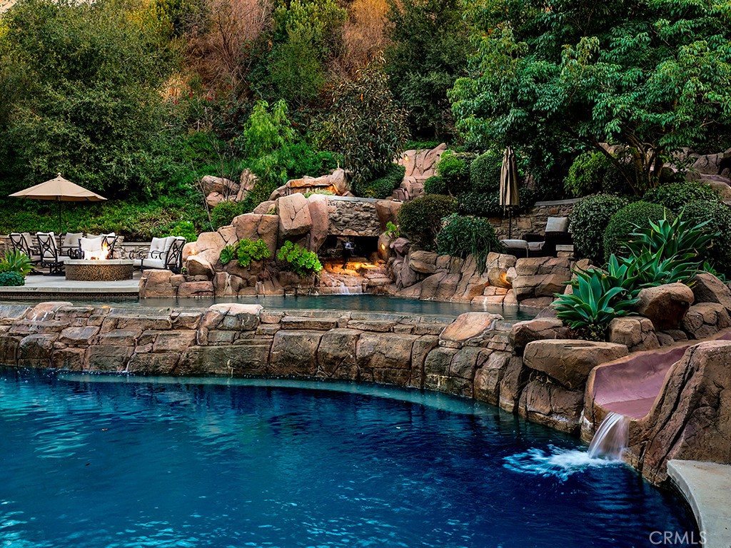 28291 Williams Canyon Road Silverado, CA 92676 - Photo 66 of 74 a view of a lake with lawn chairs under an umbrella