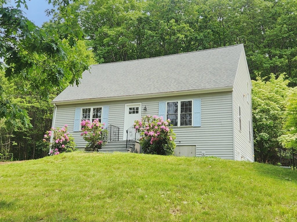 169 Gore Road Webster, MA 01570 - Photo 3 of 15 a house view with a garden space