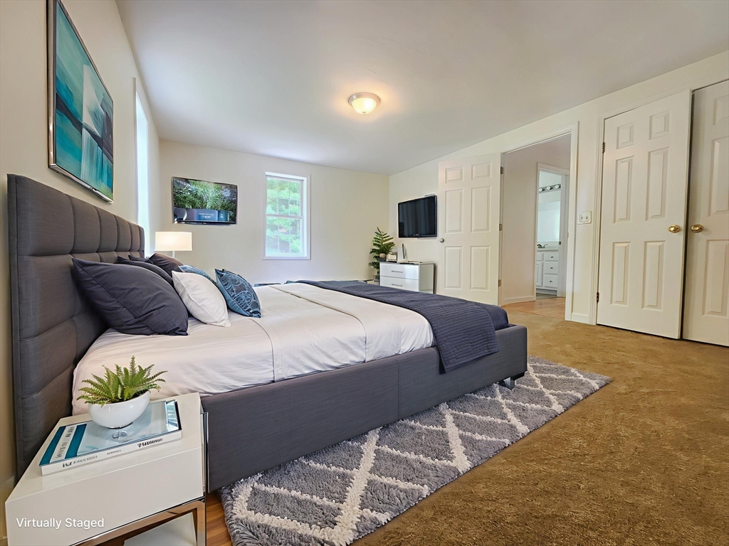 169 Gore Road Webster, MA 01570 - Photo 10 of 15 a bedroom with a bed and a couch