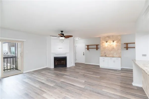 a room view with wooden floor and staircase