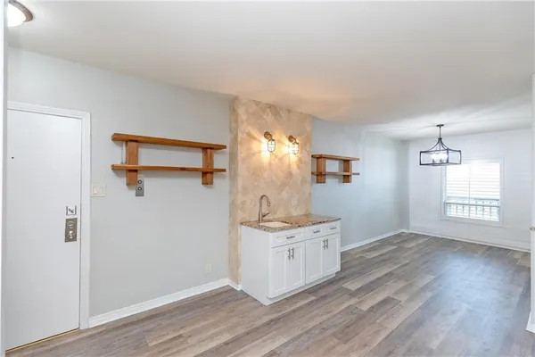 a view of a kitchen and a sink wooden floor