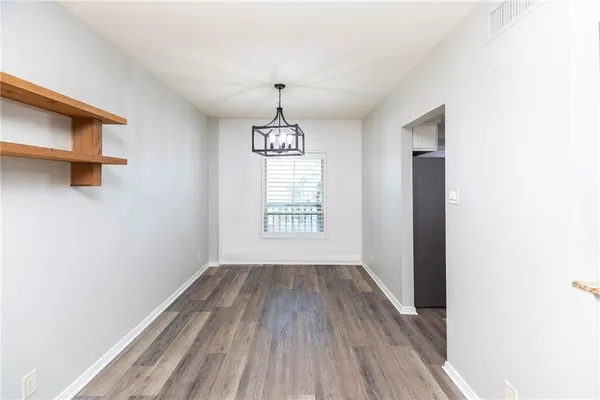 a large kitchen with stainless steel appliances granite countertop a sink stove and microwave