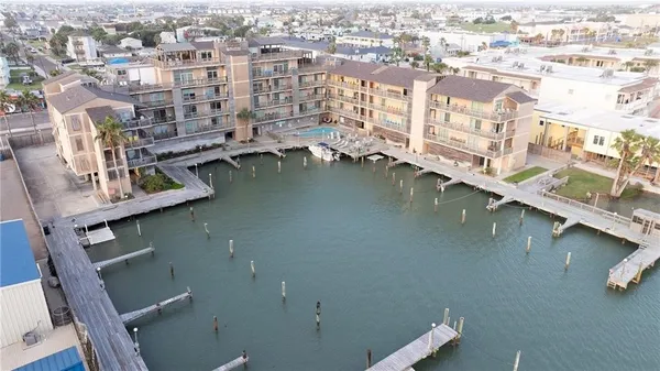 a view of residential houses with outdoor space and lake view
