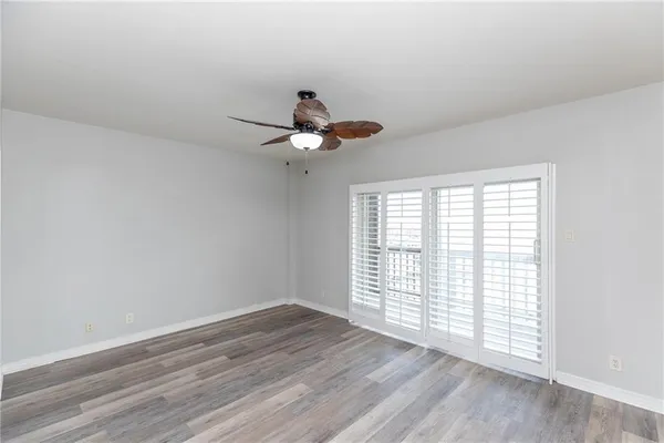 a bathroom with a granite countertop tub sink toilet and mirror