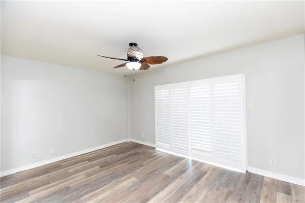 a view of an entryway and wooden floor