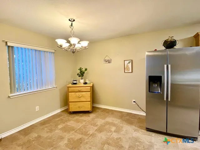 a view of a refrigerator in the kitchen