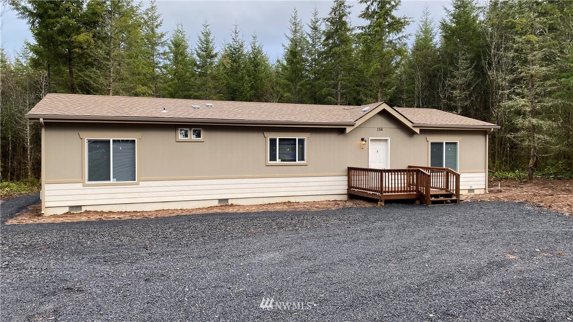 156 Nelson Road Winlock, WA 98596 - Photo 1 of 19 a view of a house with a backyard and trees
