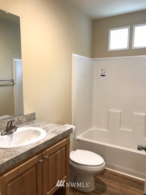156 Nelson Road Winlock, WA 98596 - Photo 12 of 19 a bathroom with a granite countertop sink toilet and a bathtub