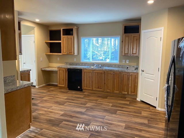 156 Nelson Road Winlock, WA 98596 - Photo 3 of 19 a large kitchen with stainless steel appliances granite countertop a stove a sink and a refrigerator